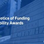 A photo of Seattle City Hall with a blue overlay on top. Text overlay reads "2022 Notice of Funding Availability Awards" with the City of Seattle logo and the Seattle Office of Housing logo.